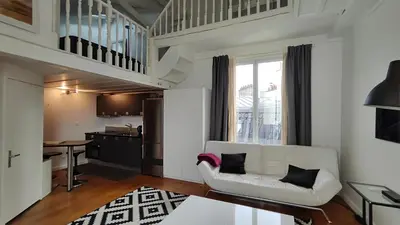 Coin salon dans l'établissement Paris 17 Apartment Near Arc de Triomphe