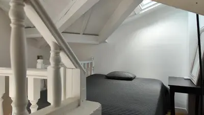 Un ou plusieurs lits dans un hébergement de l'établissement Paris 17 Apartment Near Arc de Triomphe