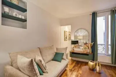 Coin salon dans l'établissement Superb Apartment Le Marais Place des Vosges