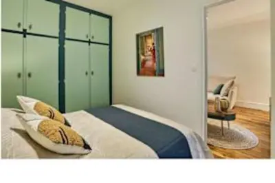 Un ou plusieurs lits dans un hébergement de l'établissement Superb Apartment Le Marais Place des Vosges
