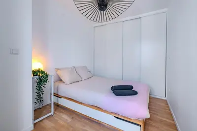 Un ou plusieurs lits dans un hébergement de l'établissement Cosy Apt 6 Guests for Family