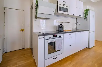 Cuisine ou kitchenette dans l'établissement Cosy Apt 6 Guests for Family