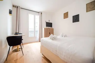 Un ou plusieurs lits dans un hébergement de l'établissement CIA - Studio du Moulin Rouge