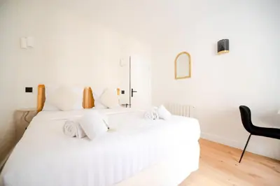 Un ou plusieurs lits dans un hébergement de l'établissement CIA - Studio du Moulin Rouge