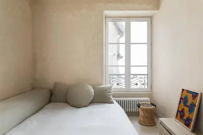 Un ou plusieurs lits dans un hébergement de l'établissement Amazing flat in an amazing Montmartre street