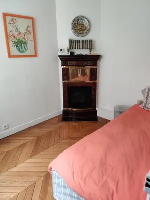 Un ou plusieurs lits dans un hébergement de l'établissement Batignolles chic 75 m2
