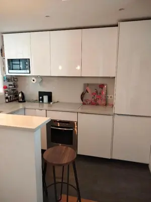 Cuisine ou kitchenette dans l'établissement Batignolles chic 75 m2