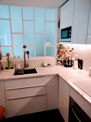 Cuisine ou kitchenette dans l'établissement Batignolles chic 75 m2