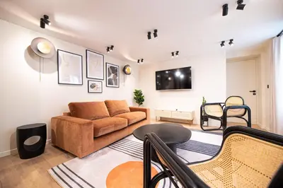 Télévision ou salle de divertissement dans l'établissement CIA - Home on Grands Boulevards