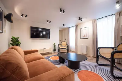 Télévision ou salle de divertissement dans l'établissement CIA - Home on Grands Boulevards