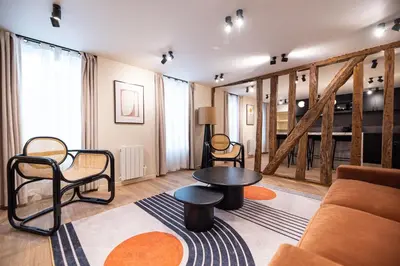 Coin salon dans l'établissement CIA - Home on Grands Boulevards