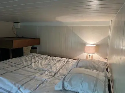 Un ou plusieurs lits dans un hébergement de l'établissement Appartement charmant à Paris 20 eme