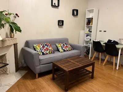 Coin salon dans l'établissement Appartement charmant à Paris 20 eme