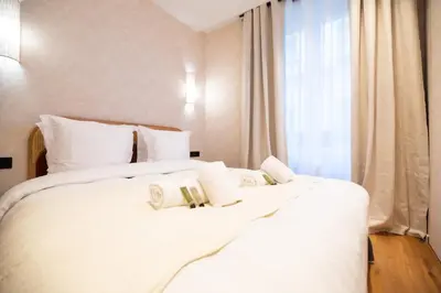 Un ou plusieurs lits dans un hébergement de l'établissement CIA - Nation - Lovely Parisian Escape