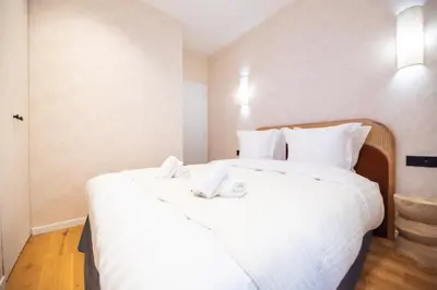 Un ou plusieurs lits dans un hébergement de l'établissement CIA - Nation - Lovely Parisian Escape