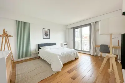 Un ou plusieurs lits dans un hébergement de l'établissement Flexliving - room - Ternes