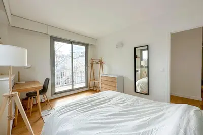 Un ou plusieurs lits dans un hébergement de l'établissement Flexliving - room - Ternes