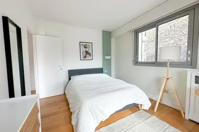 Un ou plusieurs lits dans un hébergement de l'établissement Flexliving - room - Ternes
