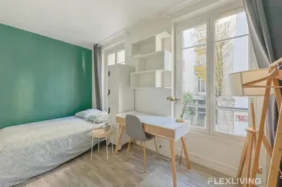 Un ou plusieurs lits dans un hébergement de l'établissement Flexliving - studio - Boulangers