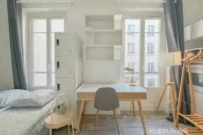Un ou plusieurs lits dans un hébergement de l'établissement Flexliving - studio - Boulangers