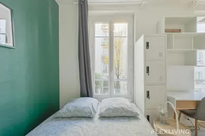 Un ou plusieurs lits dans un hébergement de l'établissement Flexliving - studio - Boulangers