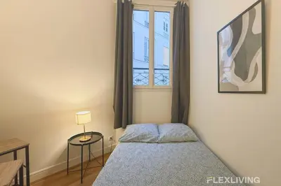 Un ou plusieurs lits dans un hébergement de l'établissement Nice Studio Design - Between Montmartre & Opéra Garnier