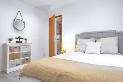 Un ou plusieurs lits dans un hébergement de l'établissement Appartement 4 Guests aux Invalides