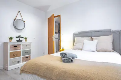 Un ou plusieurs lits dans un hébergement de l'établissement Appartement 4 Guests aux Invalides