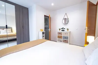 Un ou plusieurs lits dans un hébergement de l'établissement Appartement 4 Guests aux Invalides