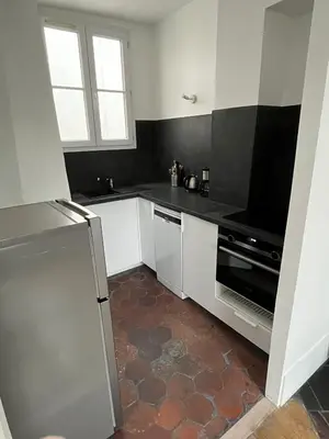Cuisine ou kitchenette dans l'établissement Mouffetard 3 rooms