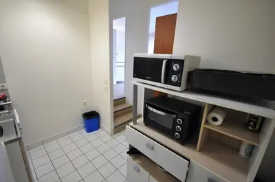 Cuisine ou kitchenette dans l'établissement Nice 36 m2 - Parc des Buttes Chaumont!