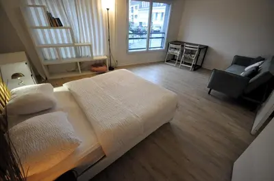 Coin salon dans l'établissement Nice 36 m2 - Parc des Buttes Chaumont!