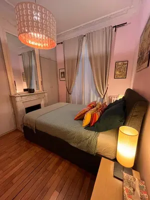 Un ou plusieurs lits dans un hébergement de l'établissement Magnifique appartement avec terrasse à côté de la Tour Eiffel