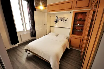 Un ou plusieurs lits dans un hébergement de l'établissement Warm and comfortable studio in Montmartre