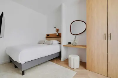 Un ou plusieurs lits dans un hébergement de l'établissement Appartement Moderne - 3BR-6P - Montorgueil