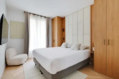 Un ou plusieurs lits dans un hébergement de l'établissement Appartement Moderne - 3BR-6P - Montorgueil