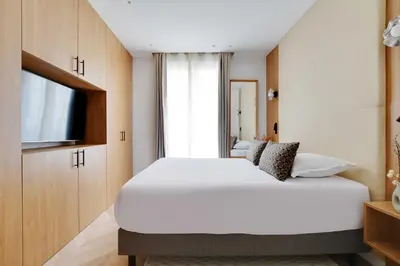 Un ou plusieurs lits dans un hébergement de l'établissement Appartement Moderne - 3BR-6P - Montorgueil