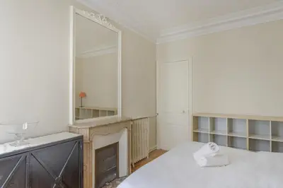 Un ou plusieurs lits dans un hébergement de l'établissement Paris Courcelles Prestige Residence