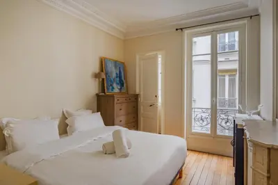 Un ou plusieurs lits dans un hébergement de l'établissement Paris Courcelles Prestige Residence