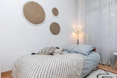 Un ou plusieurs lits dans un hébergement de l'établissement Cœur de Voltaire - Appartement Cosy&Design