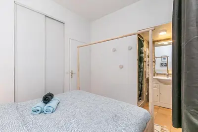Un ou plusieurs lits dans un hébergement de l'établissement Cœur de Voltaire - Appartement Cosy&Design