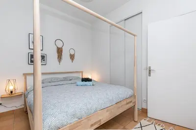 Un ou plusieurs lits dans un hébergement de l'établissement Cœur de Voltaire - Appartement Cosy&Design
