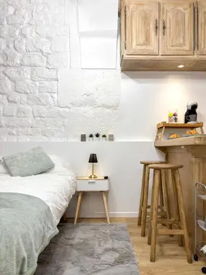 Un ou plusieurs lits dans un hébergement de l'établissement Le Columba-Studio Parisien Saint-Germain
