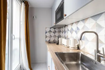Cuisine ou kitchenette dans l'établissement Relax in a Contemporary Designer Apartment