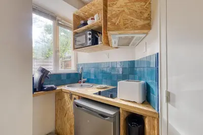 Cuisine ou kitchenette dans l'établissement Le Nid Azur Cosy Studio Proche De Paris