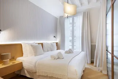 Un ou plusieurs lits dans un hébergement de l'établissement Luxury Apartment Saint Honore I