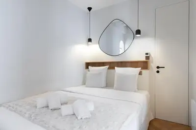 Un ou plusieurs lits dans un hébergement de l'établissement Luxury Apartment Saint Honore II
