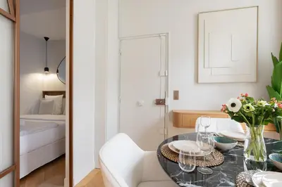 Un ou plusieurs lits dans un hébergement de l'établissement Luxury Apartment Saint Honore II