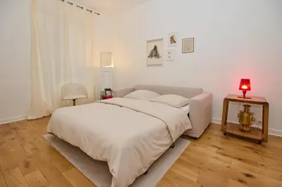 Un ou plusieurs lits dans un hébergement de l'établissement Geranimus Picasso Heart of Paris