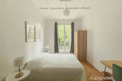 Un ou plusieurs lits dans un hébergement de l'établissement Cozy Room in Alésia Paris 14th